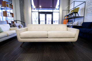 Perch Furniture's Retro Cooper Sofa has lots of midcentury features like blind tufting and a full wood base
