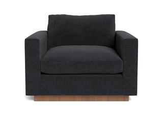 The Lowe Arm Chair in dark leather represents minimalistic home design
