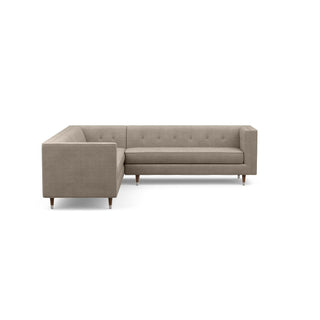 The Gramercy sofa sectional, in taupe, is a modern couch with a vintage feel