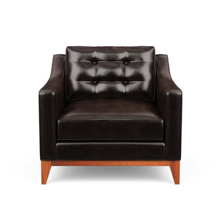 Refined traditional mid-century design is reflected in the Lawson armchair, pictured here in dark leather