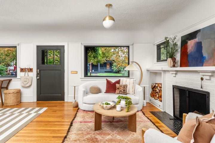 Perch Furniture's custom Alameda sofa is upholstered in white boucle fabric and featured in the Swedish Bungalow listing from Friday and Company.