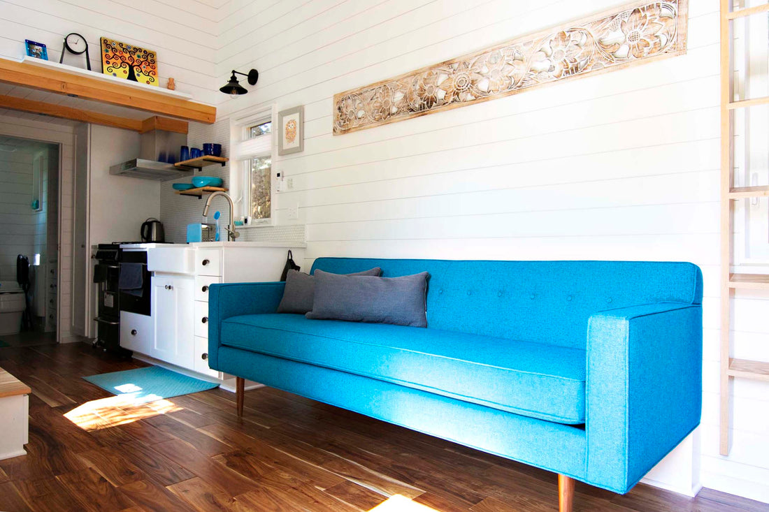 A custom sized Teal blue Sterling sofa from Perch Furniture is the centerpiece of a Portland tiny home.