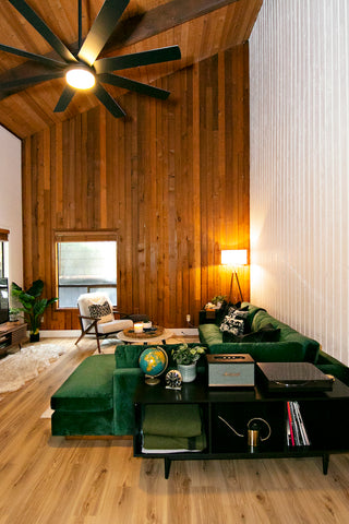 Custom green velvet Lowe sectional from Perch Furniture defines the living room of a modern cabin on Mount Hood in Rhododendron, Oregon.