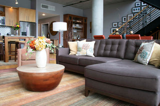 A Lawson chaise sectional from Perch Furniture makes a cozy living area in a Portland condo