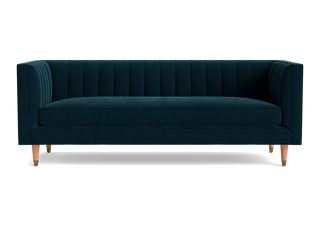 Shelter arm Belmont sofa with gold velvet and cone legs