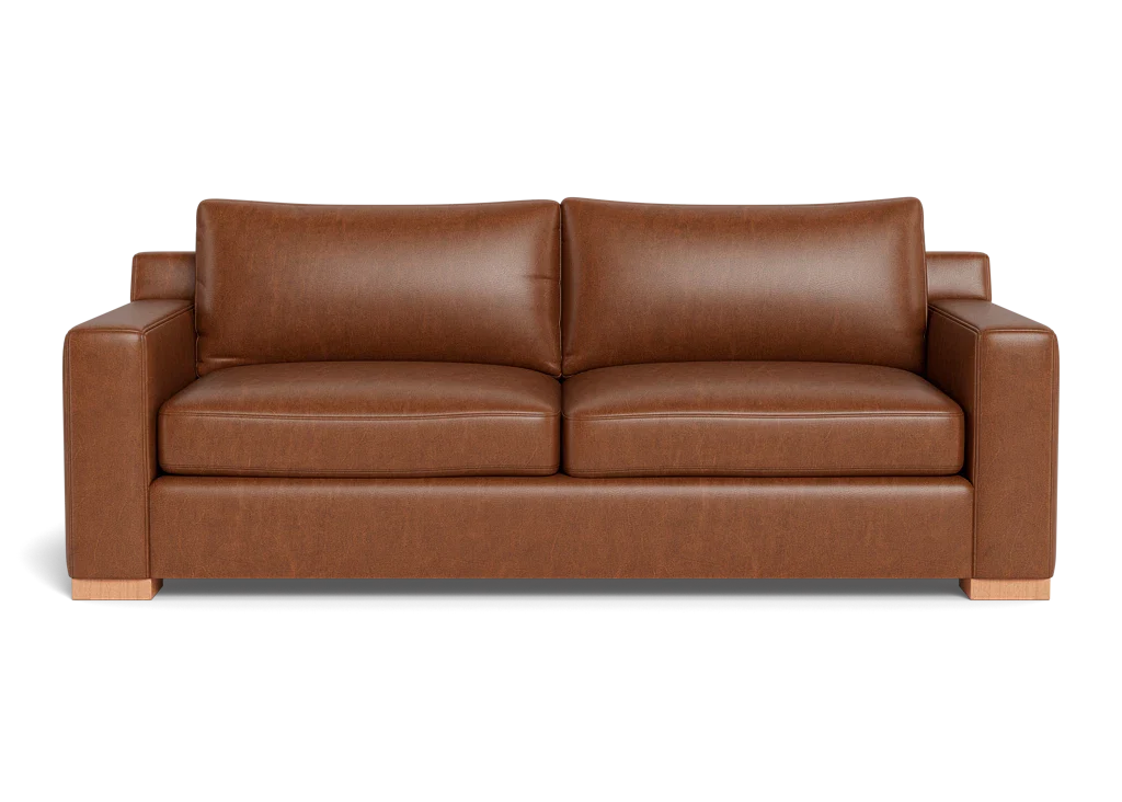  Burnside sofa in caramel leather with deep seat, wide track arms and block legs in walnut. 