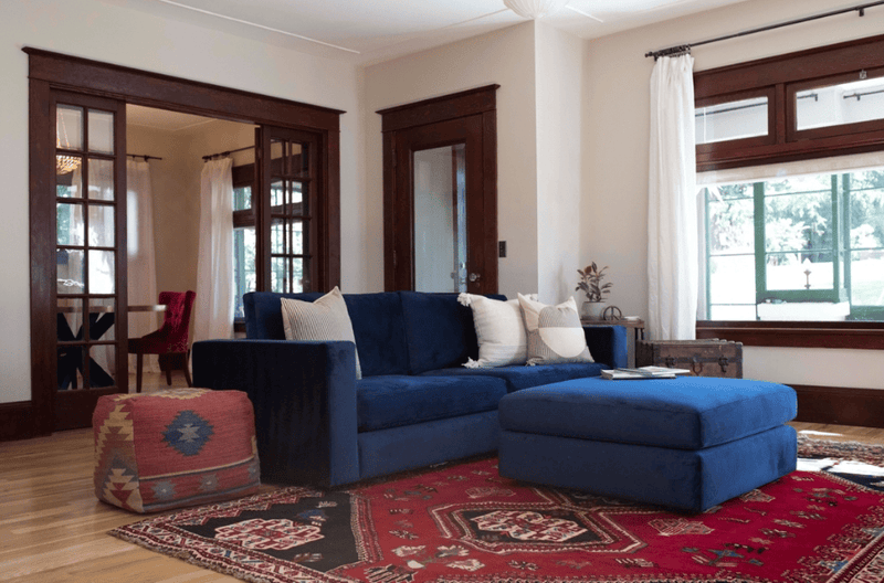 Deep navy blue sofa in a modern living room.